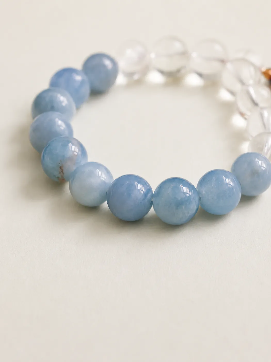 Coastal Breeze Tassel Bracelet, bead and charm detail, showing its distinctive color story