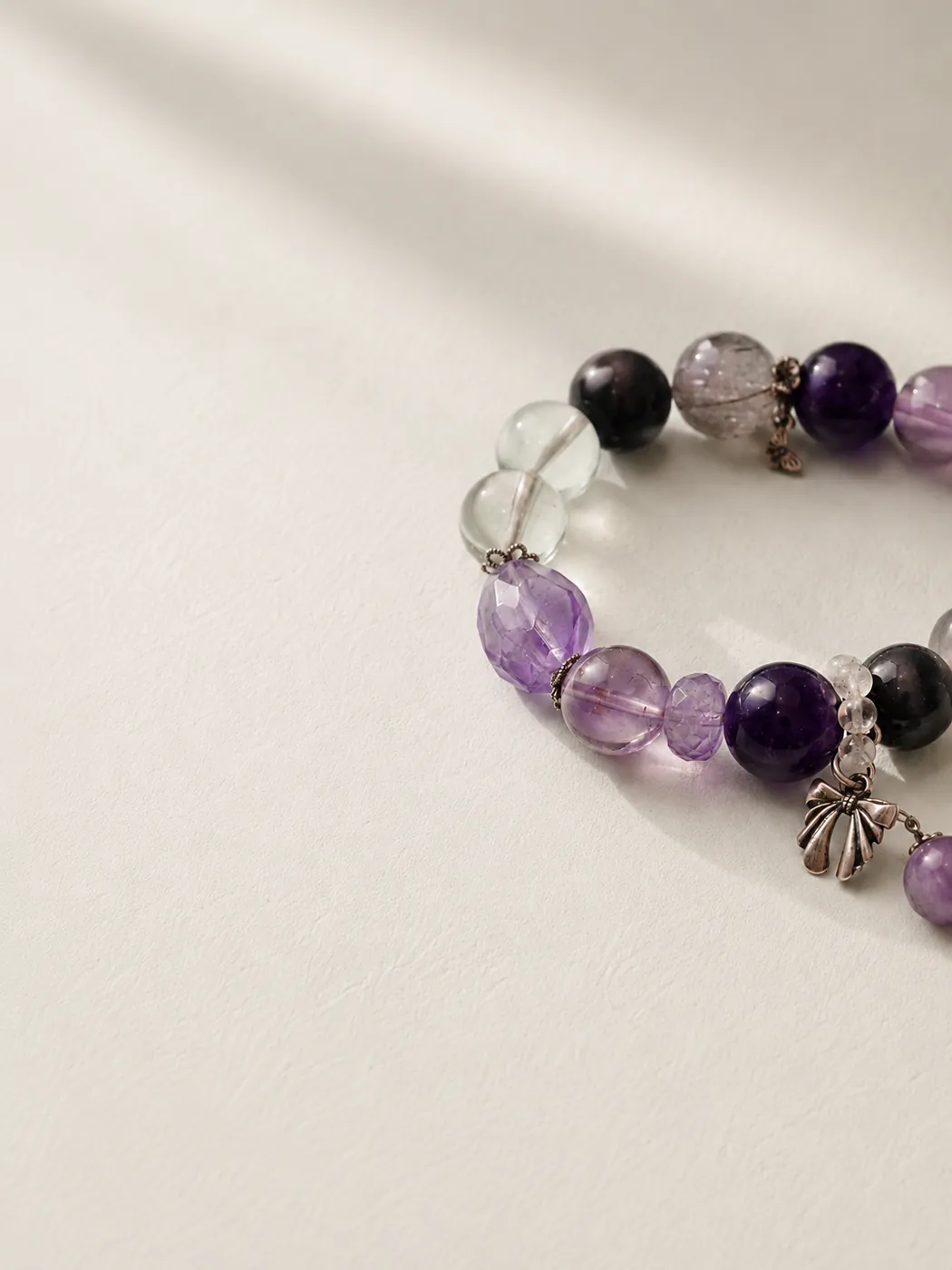 Crimson Grove Zodiac Charm Bracelet, editorial setting, showing its distinctive color story