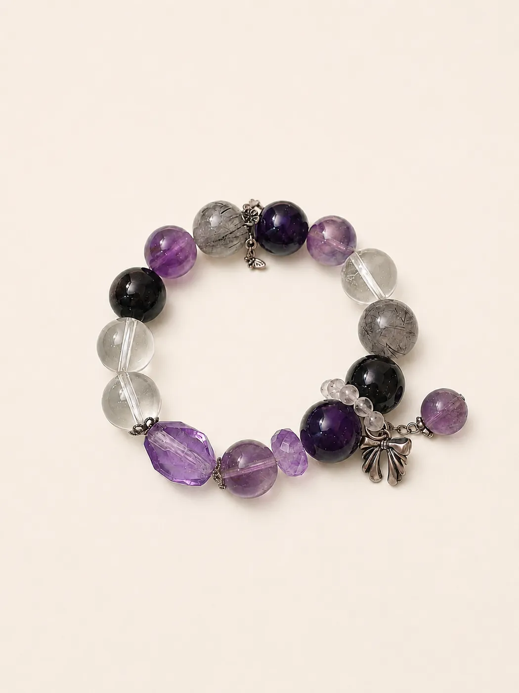 Crimson Grove Zodiac Charm Bracelet, front view, showing its distinctive color story