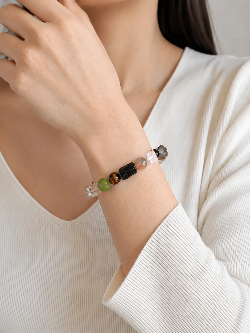 Earth & Ember Crab Charm Bracelet, styled on wrist, showing its distinctive color story