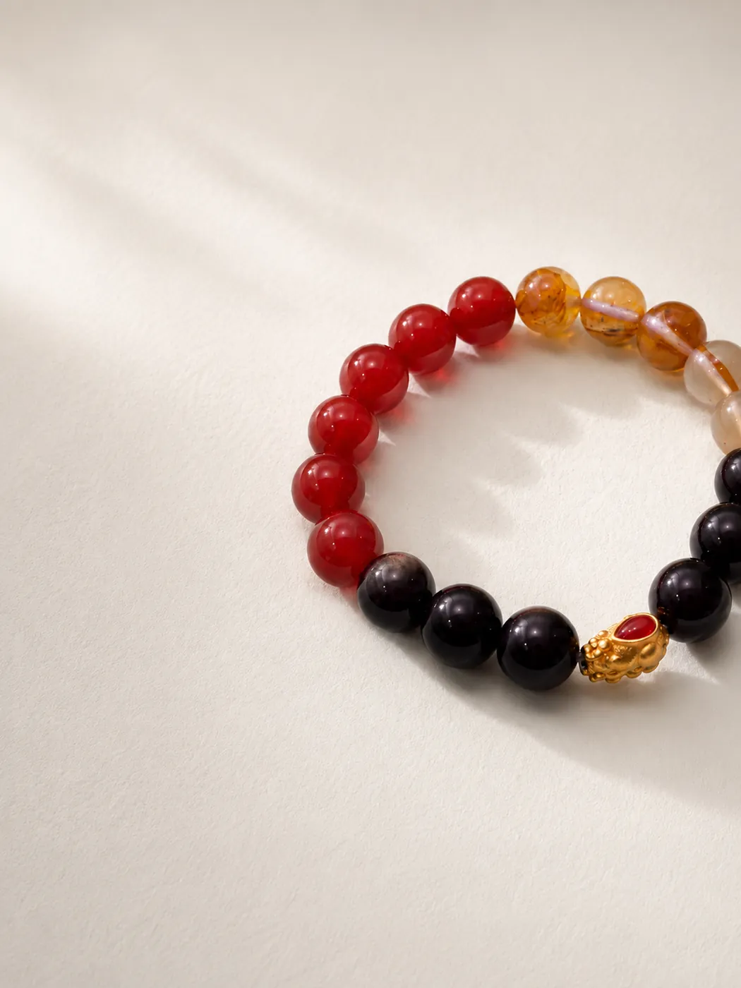 Sunset Ember Gold-Tone Accent Bracelet, editorial setting, showing its distinctive color story