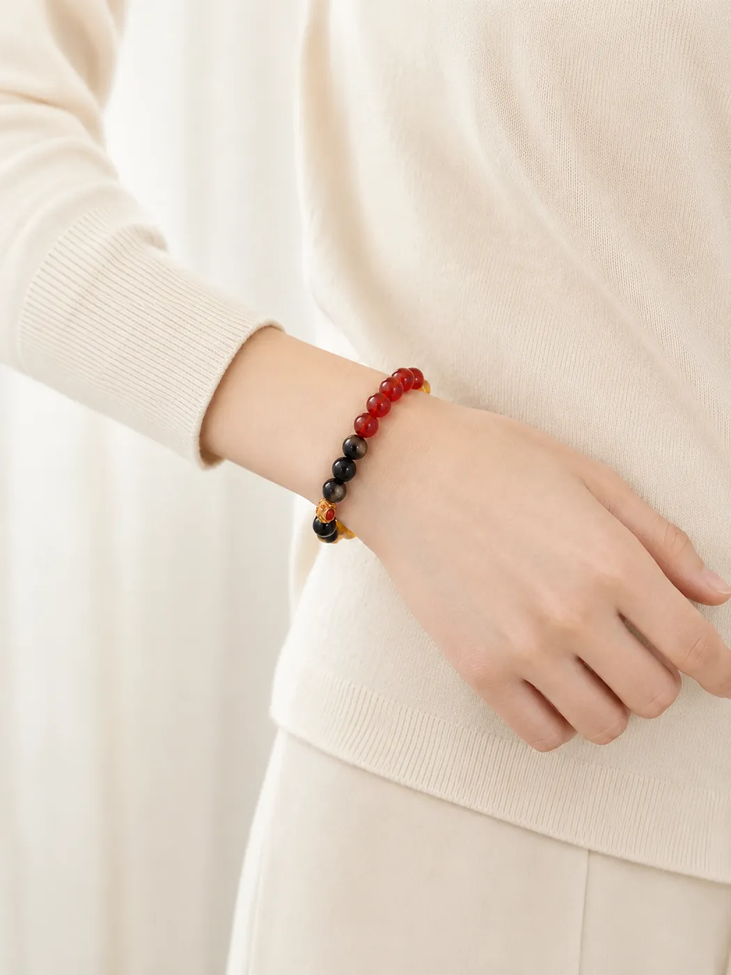 Sunset Ember Gold-Tone Accent Bracelet, styled on wrist, showing its distinctive color story