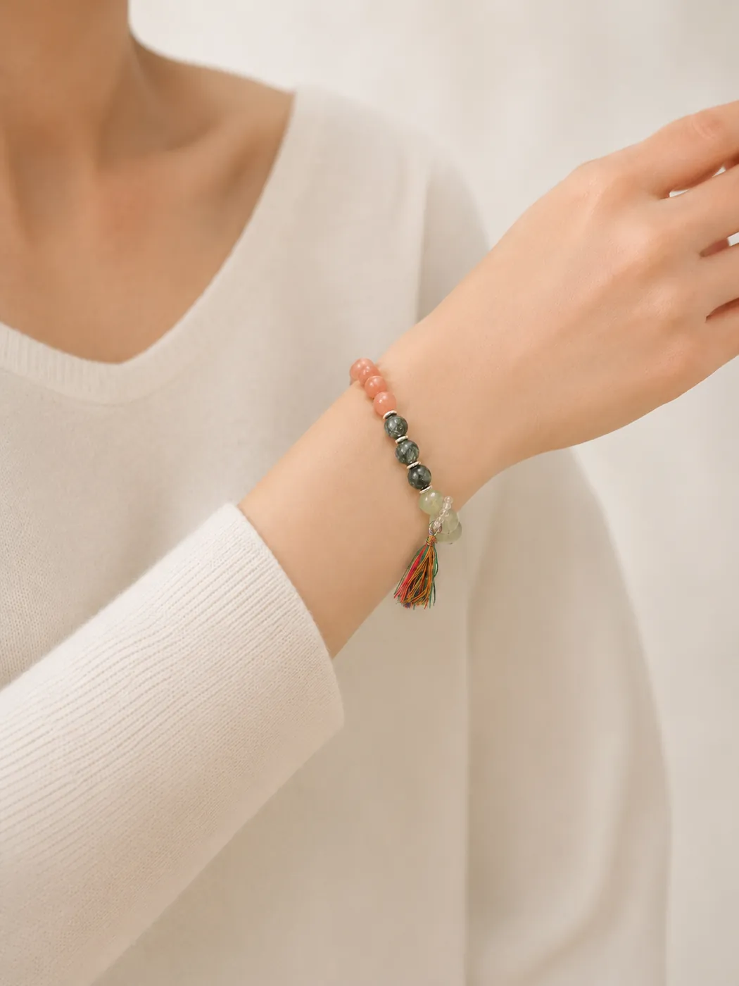 Sunset Grove Tassel Bracelet, styled on wrist, showing its distinctive color story